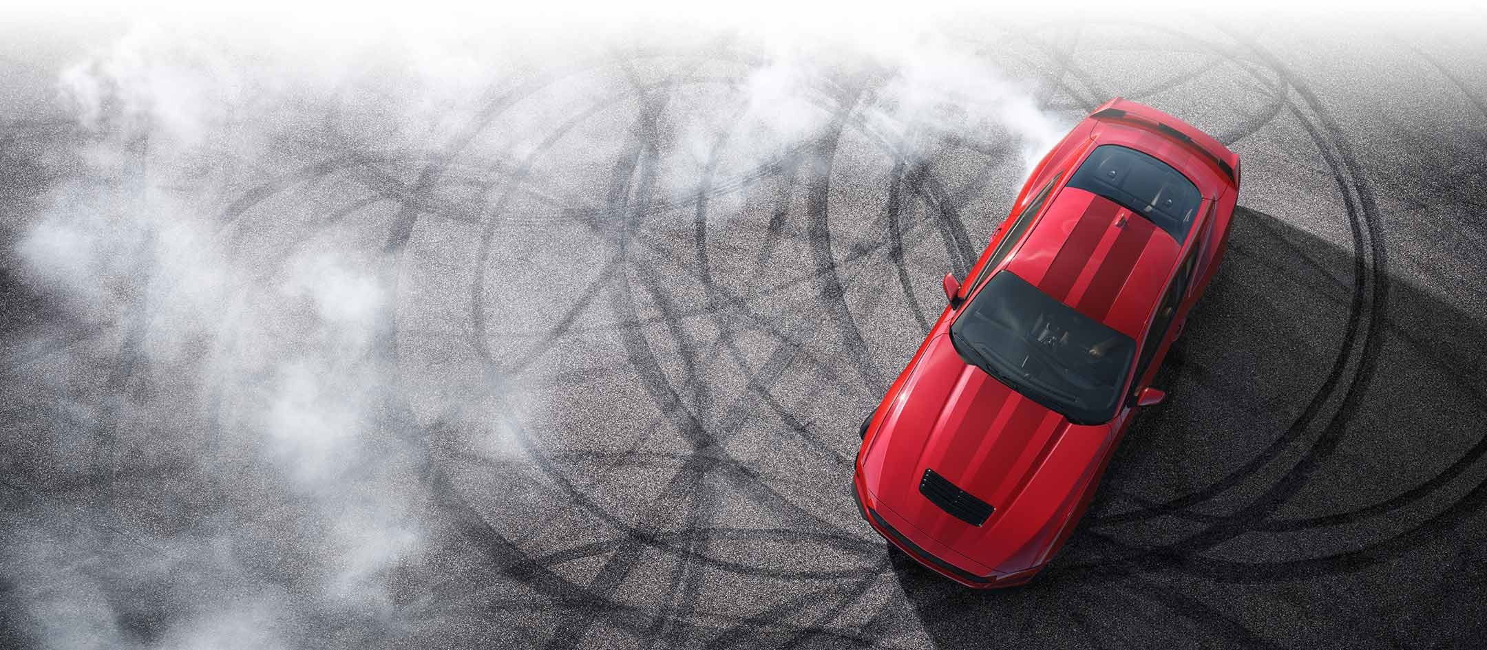 Overhead view of a 2024 Ford Mustang® model with tire tracks on pavement | Pfeifle Ford in Wishek ND