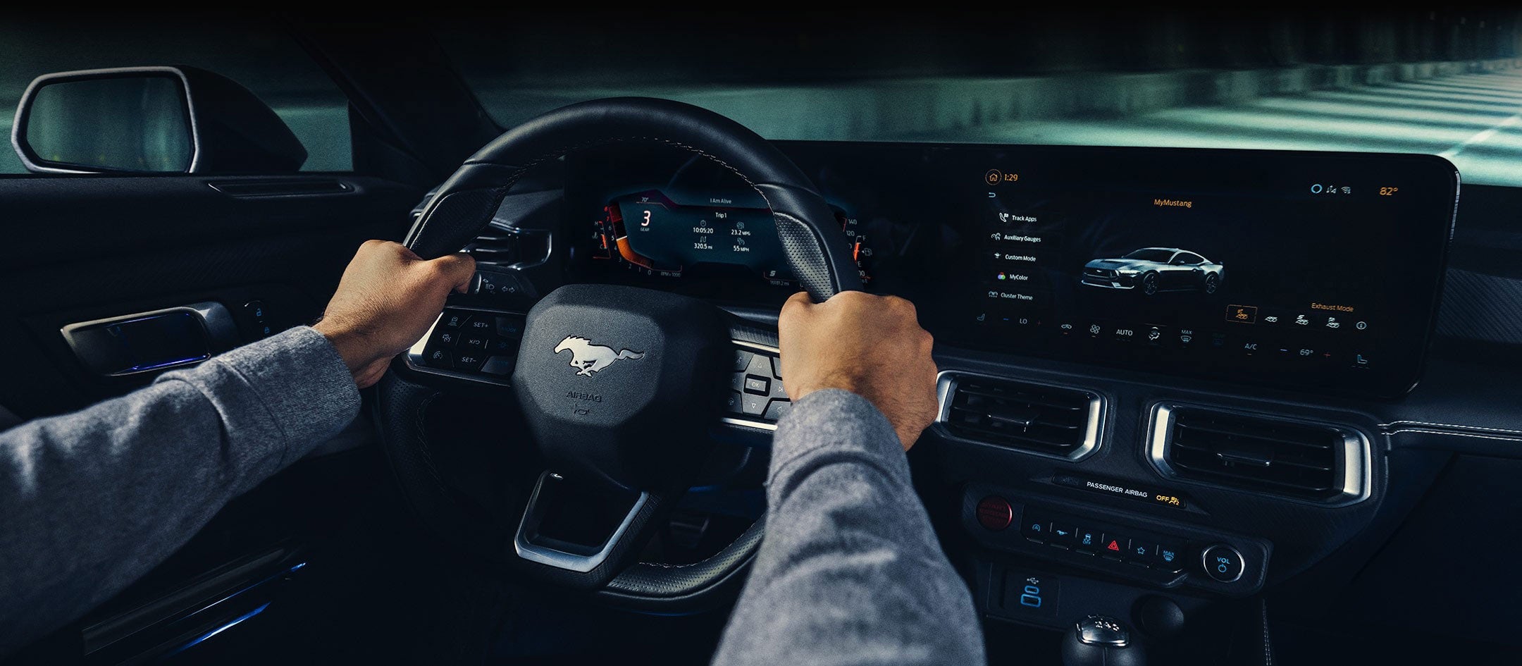 A 2024 Ford Mustang® model interior with a person driving | Pfeifle Ford in Wishek ND